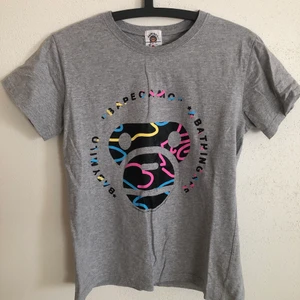 Women’s Bape Baby Milo Tee - Women’s Bape / A Bathing Ape Baby Milo T-Shirt  Size small, women’s fit.  Great condition, no flaws or damage.  DM if you need exact size measurements.   Buyer pays for all shipping costs. All items sent with tracking number.   No swaps, no trades, no offers.  