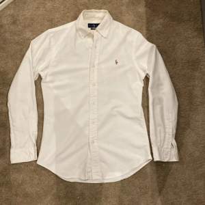 White Polo Ralph Lauren Oxford. Size is S. In brand new condition.