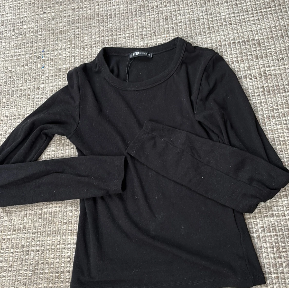 Svart långärmad topp från FB Sister
