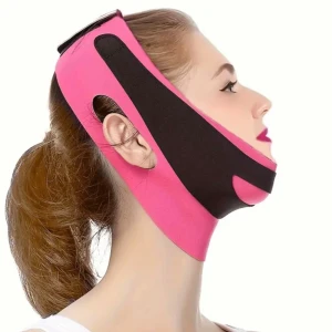 Rosa ansiktsbandage - Säljer ett rosa ansiktsbandage i elastiskt material. Perfekt för att ge stöd och komfort. Justerbar med kardborreband för bästa passform. Används för att forma och lyfta ansiktet. Färgen är en snygg rosanyans med svarta detaljer. Använd en gång. Stretchig och bekväm att ha på sig. Hål för öronen och den sitter på plats även under natten.  Pris går att diskutera