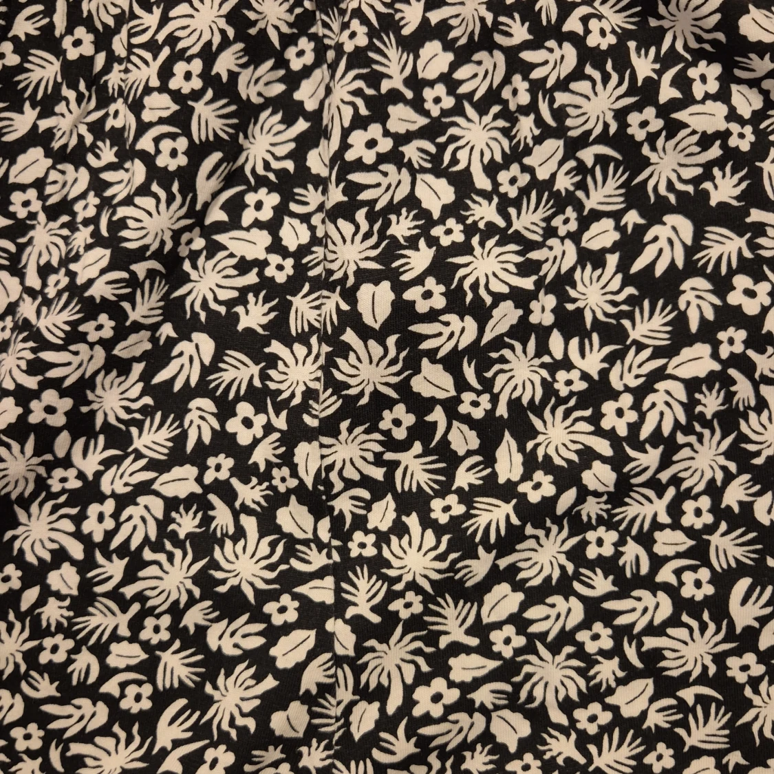 Blommig byxdress - 90