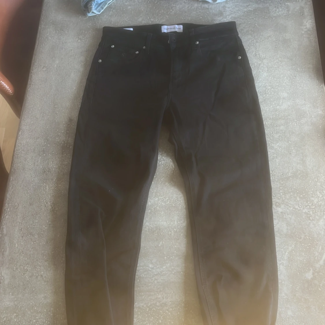 Svarta slim taper jeans från Calvin Klein