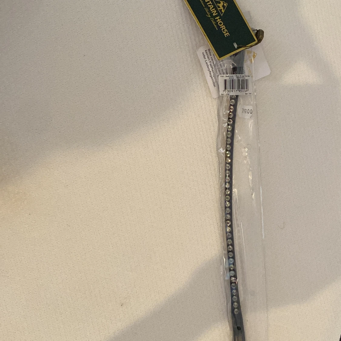 Svart pannband med glittriga stenar