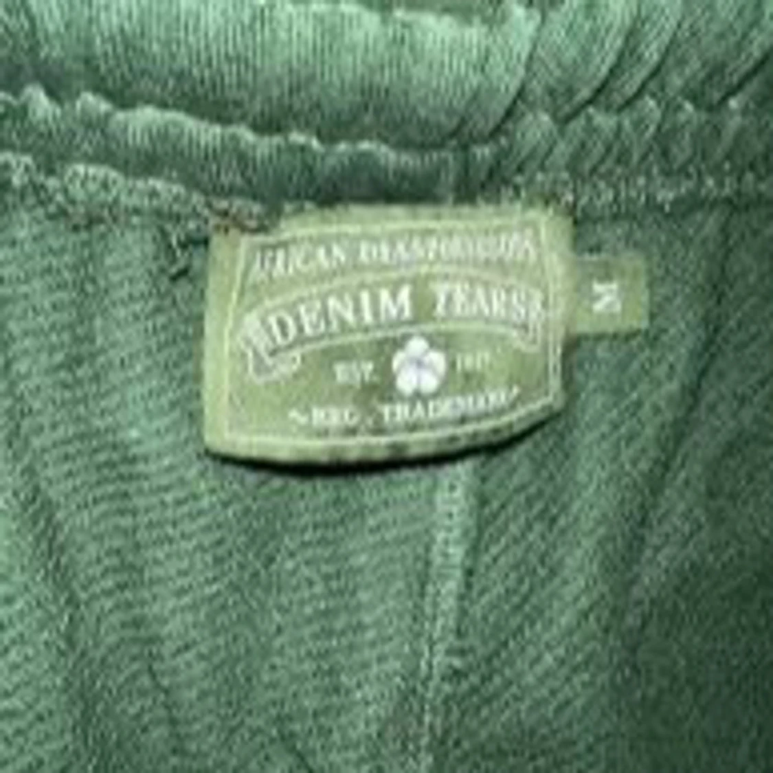 Gröna mjukisbyxor med vita blommor från Denim Tears - 1