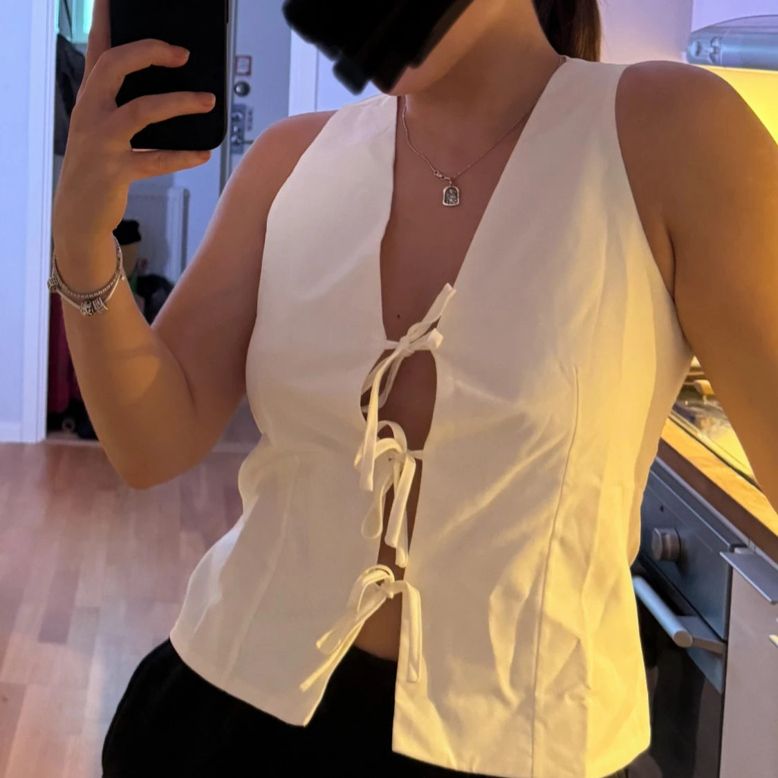 Topp med snörning framtill