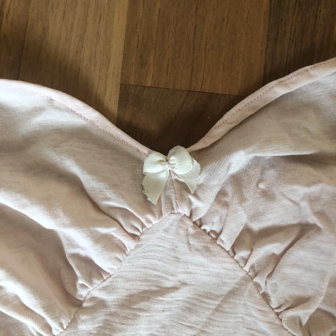 Ljusrosa linnetopp med rosett - 1