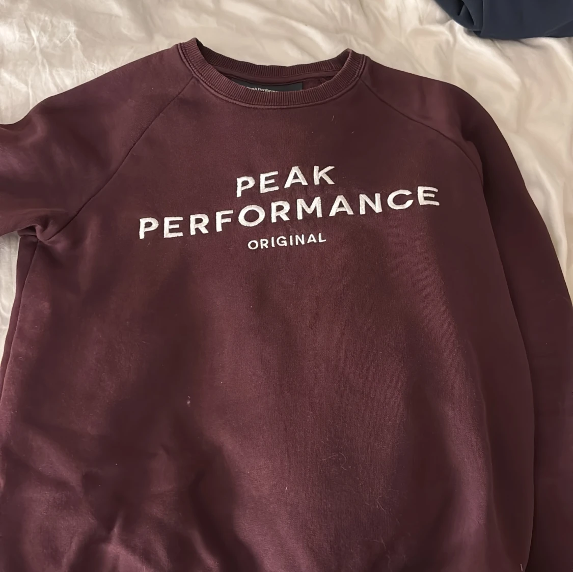 Vinröd sweatshirt Peak Performance XS