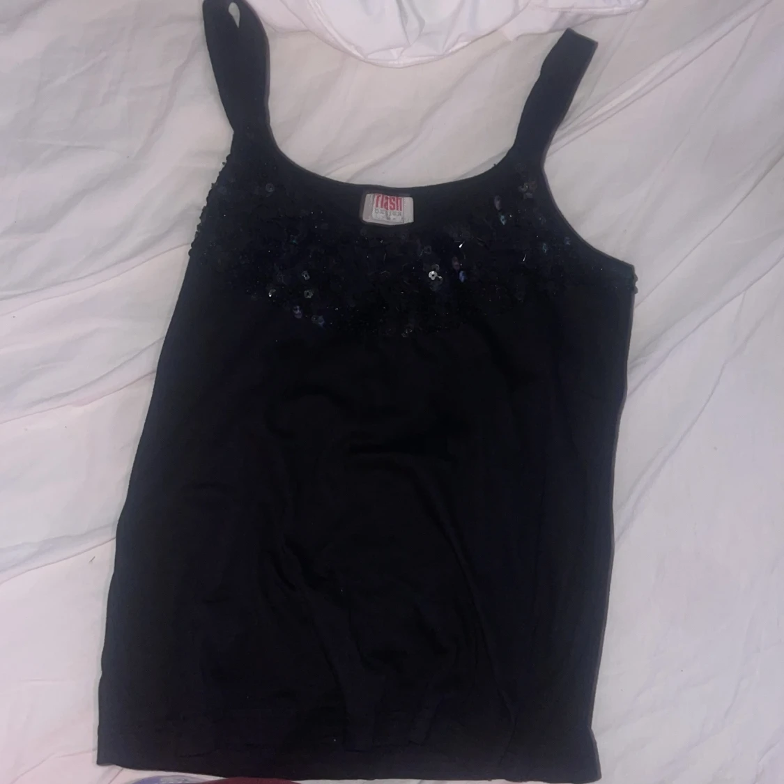 Svart paljettlinne från Flash - 2