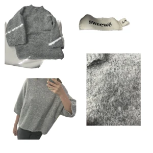 Grå stickad tröja från Sweewë - Mysig grå stickad tröja från Sweewë med oversized passform och breda, trekvartsärmar. Tröjan har en hög, ribbad halsringning och är perfekt för lager-på-lager-stil. Materialet är mjukt och ger en avslappnad vibe. Inga defekter.