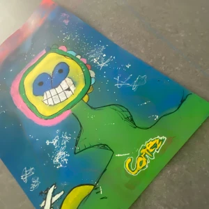 Det är en poster med murikami och corteiz - Det är en spry paintade poster av mig själv om Murakami blomman oh det rosa är typ ett c för corteiz