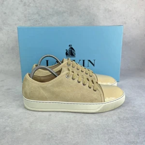 Lanvin DBB1 cap toe sneaker - – Condition: 9/10 - pristine  - Size: 40/UK6  – What is included: Only the sneakers  – Retail price: 5000 + SEK  Please note that Lanvins fit big and our recommendation is to go one size down
