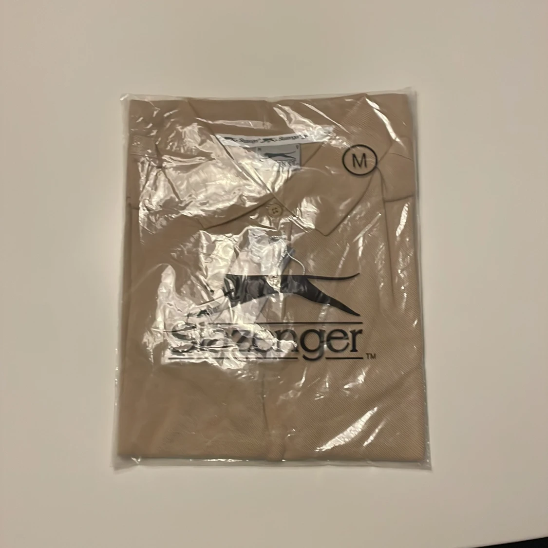 Beige pikétröja från Slazenger