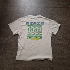 Brain Dead tshirt - White brain dead tshirt that fits tts medium. Has two tiny holes at the bottom on the front side, but it's not that noticeable. 