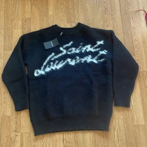 Svart stickad tröja från Saint Laurent - Storlek S. Mohair tröja aldrig använd ny