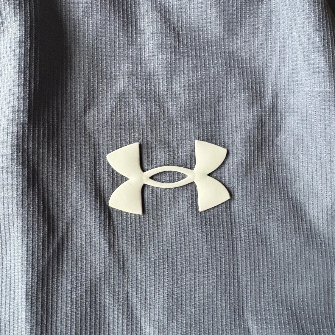 Blå/grå vindjacka från Under Armour stl S