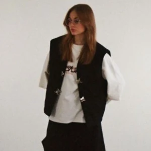 Black denim vest  - Cotton vest with carabiners  Has been worn only 3 times  Composition: 97% cotton, 3% elastane