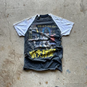 Reworked Raglan Tee - Crafted from a trio of vintage T-shirts, expertly combined in the timeless raglan cut, each shirt thoughtfully selected to form this unique piece.