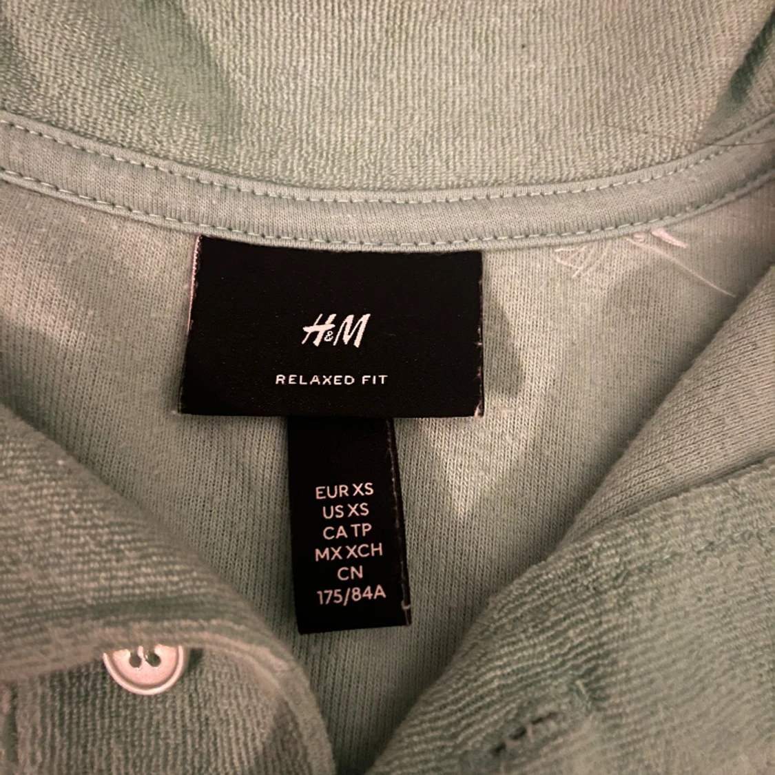 En ljusgrön frotté tröja - 90