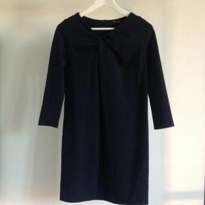 Navy blue Massimo Dutti jersey dress. Stretchy material, above knee length, 3/4 length sleeves, decorative fabric folding on chest. Worn just a few times.