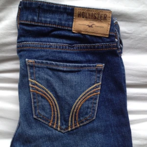  - Hollister, medium washed boot cut jeans with low waist