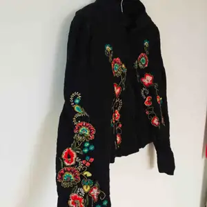 Black jacket with beautiful ornaments 