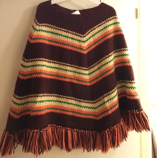 A very beautiful vintage poncho from 60-70's. 
By touching the quality, I assume it should be handmade with 100%wool in a super great condition.. Stickat.