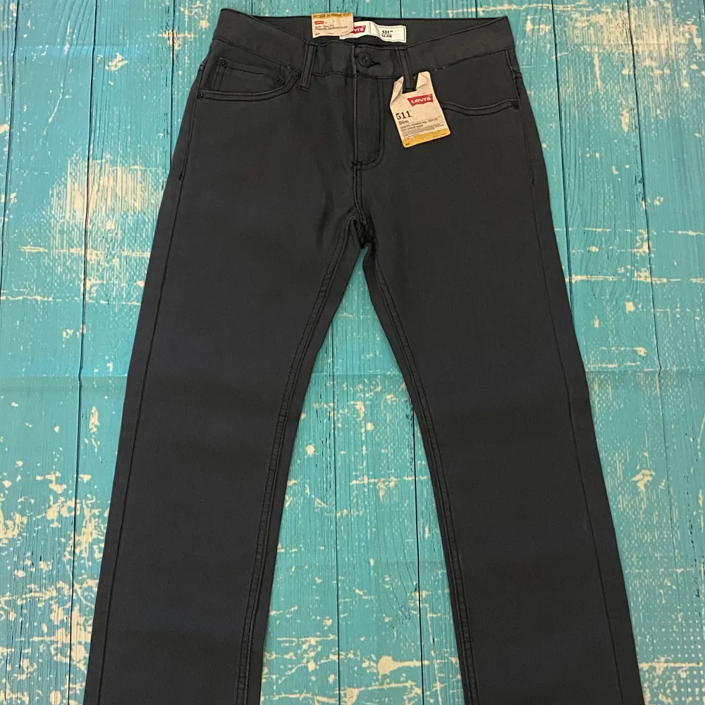 New with Tag! Original Price: $42.00 Black Slim Fit Tapered Jeans with straight leg, non-stretch, size 14 regular 27x27 be sure your true to size. . Jeans & Byxor.