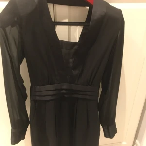  - Beautiful dress from Warehouse uk . Never been used  Little black dress Chiffon sleeves. Tuxedo style dress 