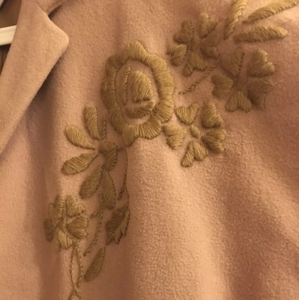 This jacket was bought in a vintage store. 
Embroidery flowers are presented in the second picture,  very elegant and beautiful from 70's.
80% pure wool, perfect condition!. Jackor.