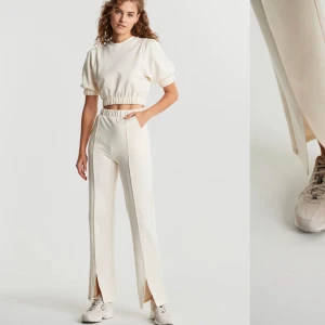 Byxor från Gina  - snygga och jättesköna byxor från Gina i en vit/ljusbeige färg! Liten slits där nere också! Långa i benen, passar mig som är 180:) Storlek M och använda 1 gång