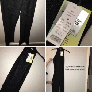  - Riktigt snygg fest- byxdress, glittrigt tyg. Aldrig använd då den tyvärr är för lång för mig! 