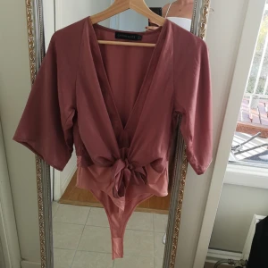  - Supersnygg body. Tyvärr kommer den inte till användning 