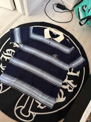 Christian Dior Navy blue stripe polo shirt - Size M, true to size. Very comfortable and fits nicely. Brand new
