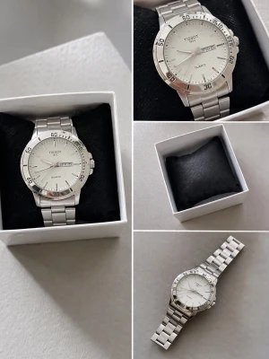 Tissot silverfärgad herrklocka - Stilren klocka från Tissot i silverfärgat metallarmband och boett. Klassisk rund urtavla med datum- och veckodagsvisning. Quartz-urverk och tydliga markeringar på vridringen. Perfekt accessoar för dig som gillar tidlös design.