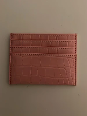 Rosa korthållare HM - Rosa korthållare från HM. 