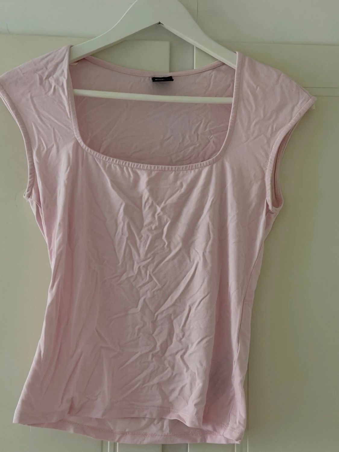 Ljusrosa ärmlös topp