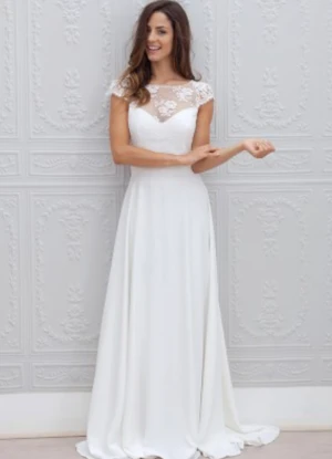 Brudklänning  - Brudklänning, A-linjeformad i chiffong och spets. Aldrig använd. 