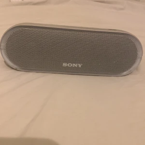 Sony Waterproof SRS-XB20 - I’ve had the speaker for a long time but never actually used it. It works as good as new and is waterproof. It’s a bit dirty due to being in the garage for a long time, but I’ll clean it before shipping it.