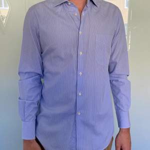 A nice Oliver Grant shirt with stripes blue and white, regularly worn but very good condition still.