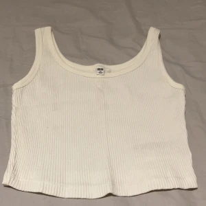 Uniqlo White Tank Top  - Cropped tank top, fits normally, brand new condition, worn once 