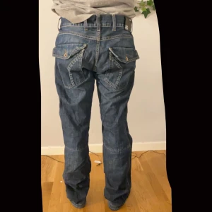 Grant jeans W34 L34 - Bekväma jeans med knappfickor