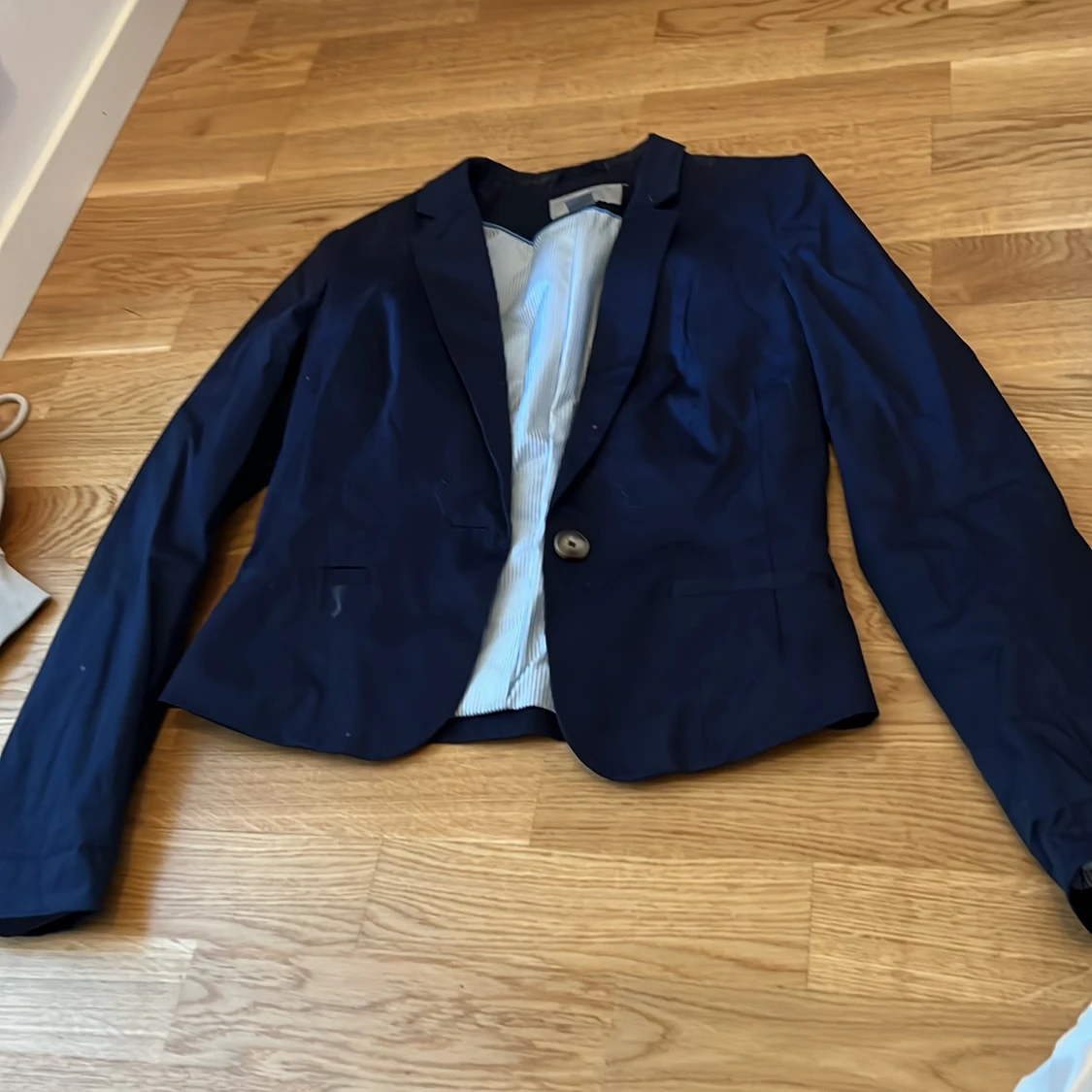 Marinblå kavaj storlek 36