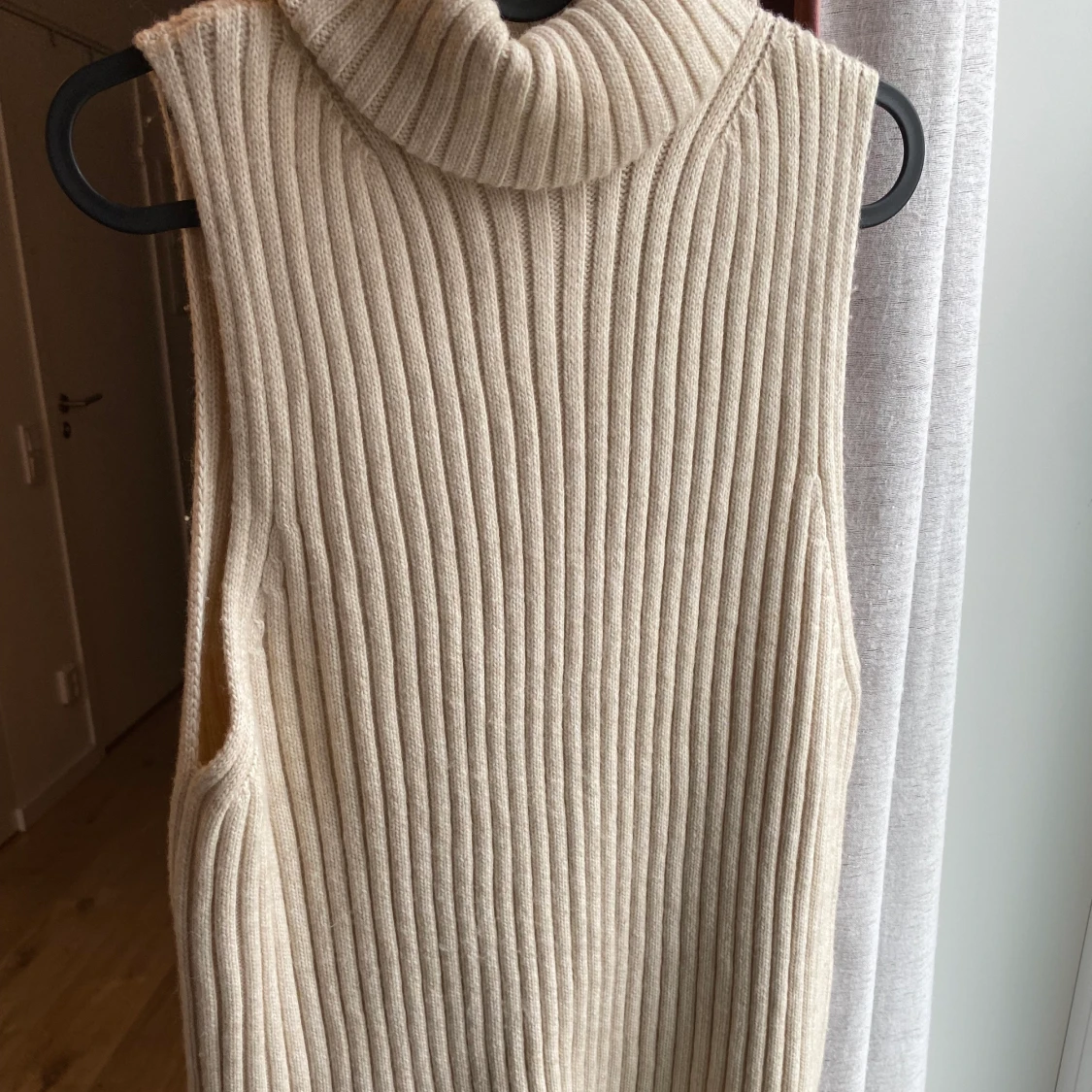 Stickad slipover/väst