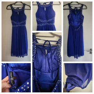 Klänning stl S - Helt ny klänning med 2 lager tyg. Snygga detaljer över byst samt paljetter. Helt ny och inget att anmärka 