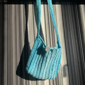 Perfect bag for that all-denim look. Crocheted with cotton yarn, dyed in various light blue shade. Handmade!