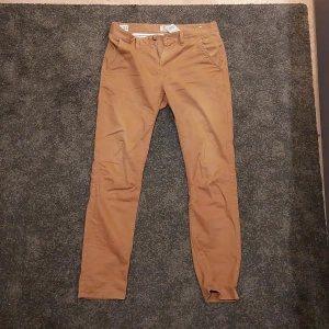 Timberland byxor - Brun orangea timberland byxor i bra skick (inga synliga skador). Slim size.