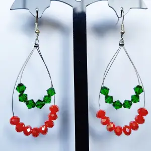 Handmade earrings with green and orange beads, new