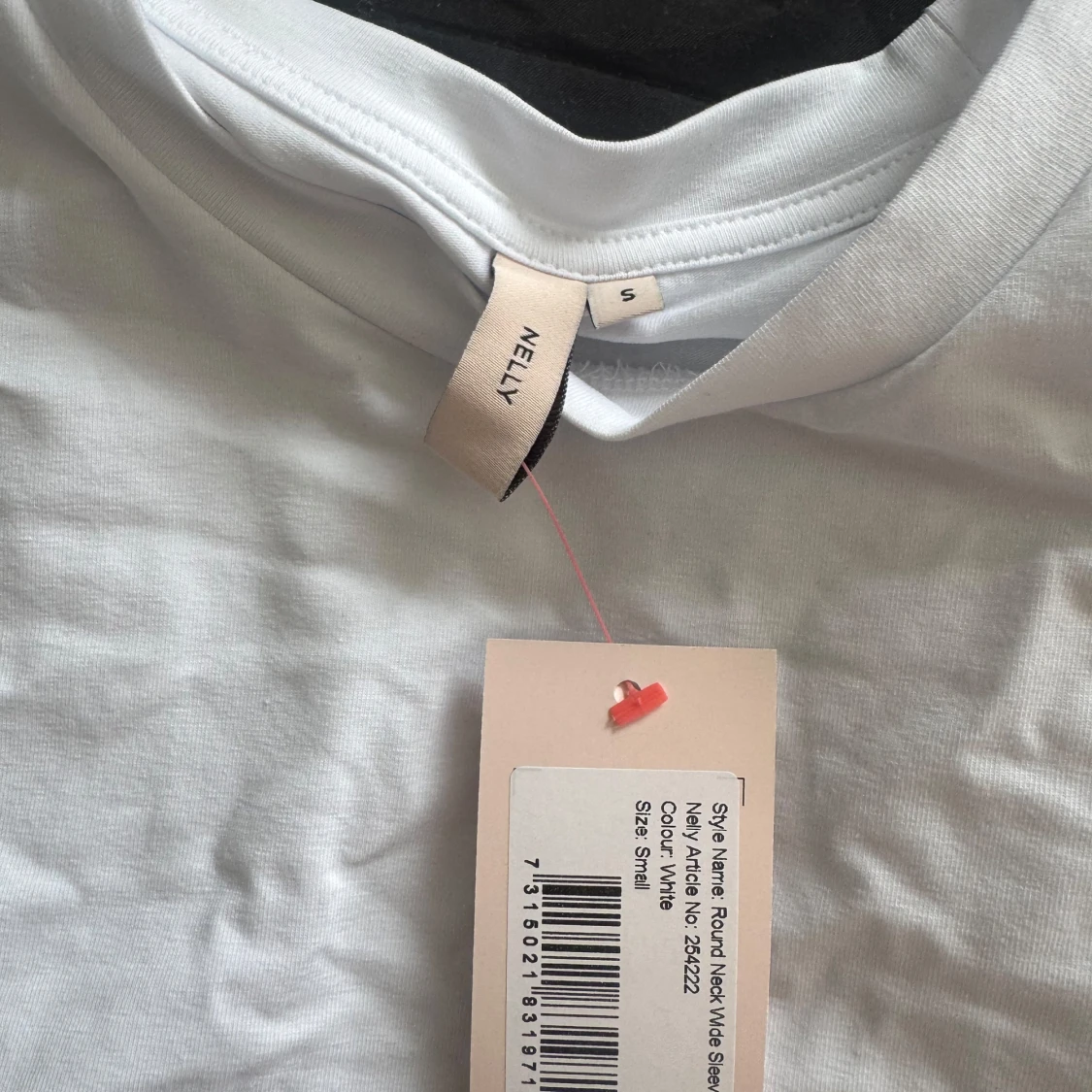 Vit vid topp från Nelly - 1