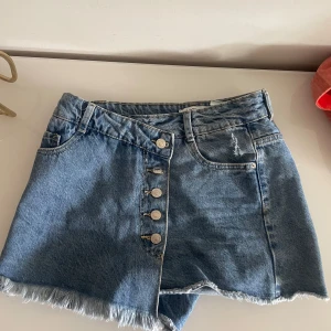 Jeans skorts - Blåa jeans skorts från Alcott.