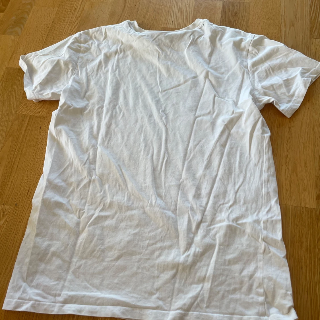 Vit t-shirt med tryck 'ICI C'EST PARIS' - 1